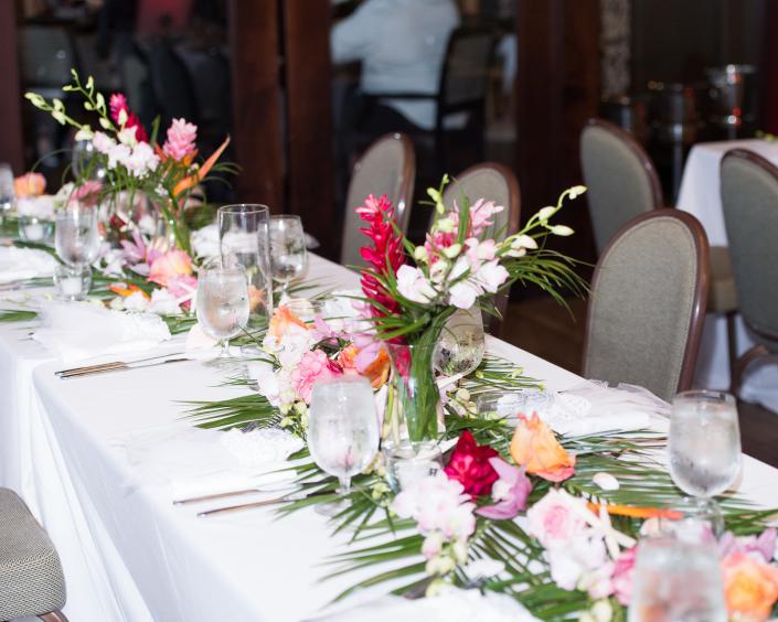 Look at our Florida and Carolina Garlands greenery, this perfect table with robellini palm leaves and loose flower scattered down the table is the perfect vibe for a tropical Wedding Anniversary Party... Fort lauderdale Fl weddings and parties.