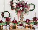Atmosphere is everything at a wedding, look at all our greens, garlands and flowers that Pink Pelican Florist used in this table centerpiece. Gorgeous Wedding Flowers by Florida and Carolina Garlands at the Brevard Zoo in Melbourne Fl