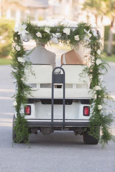 Love how our fresh plumosa wedding garland adds such a sweet touch for the bride and groom to get away... Perfect for Golf ClubHouse Weddings and  beach weddings. Weddings at Windsor in Vero Beach Fl Windsor Chapel. Florida and Carolina Garlands.
Wedding photos by Vitalic Photo Vero Beach Fl.
