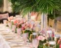 Tropical garland and centerpieces for wedding reception table