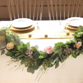 Wedding garland with succulents and roses