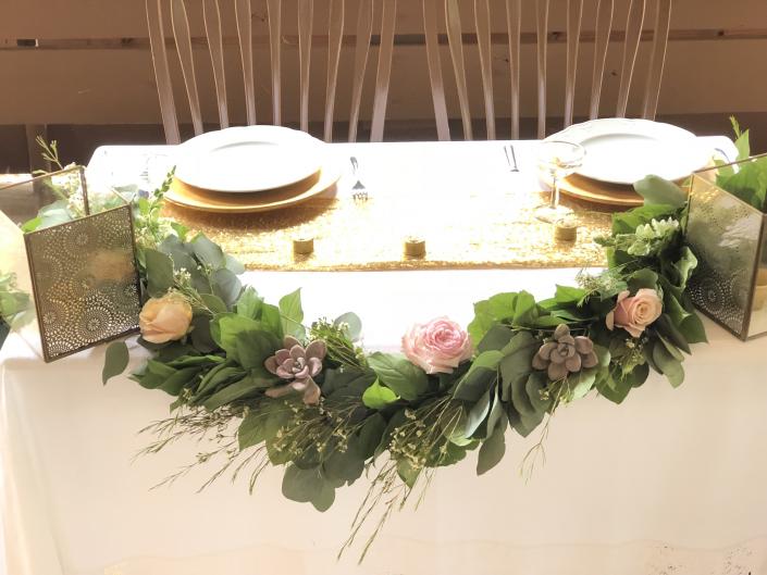 Wedding garland with succulents and roses