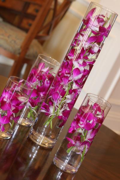Easy as 123, these beautiful demdrobium orchids can be used as centerpieces for check in table, Church flowers, Aisle decorations, Celebration of Life Ceremonies and just to have for a themed party. Just order from our Flower category and buy as many orchids you would like to use... 1 stem or 2 stem and place a floating candle on top and you have pure elegance for your event...Florida and Carolina Garlands will help you design like a professional florist.