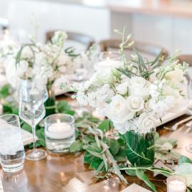 White and greenery wedding garland on table