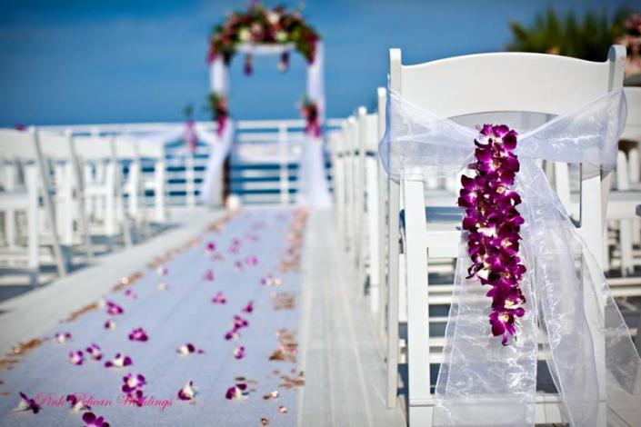 This is such a beautiful way to dress up your wedding aisle as you walk down on your wedding day! We customize the garlands by the foot, use them to hang on the chairs as pew flowers, hang the garland off a wedding arch, add it to a wedding swing and much more... Order today and get your orchid garland delivered. Florida and Carolina Garlands ship from Miami to Maine, Florida to California and all the states in between.